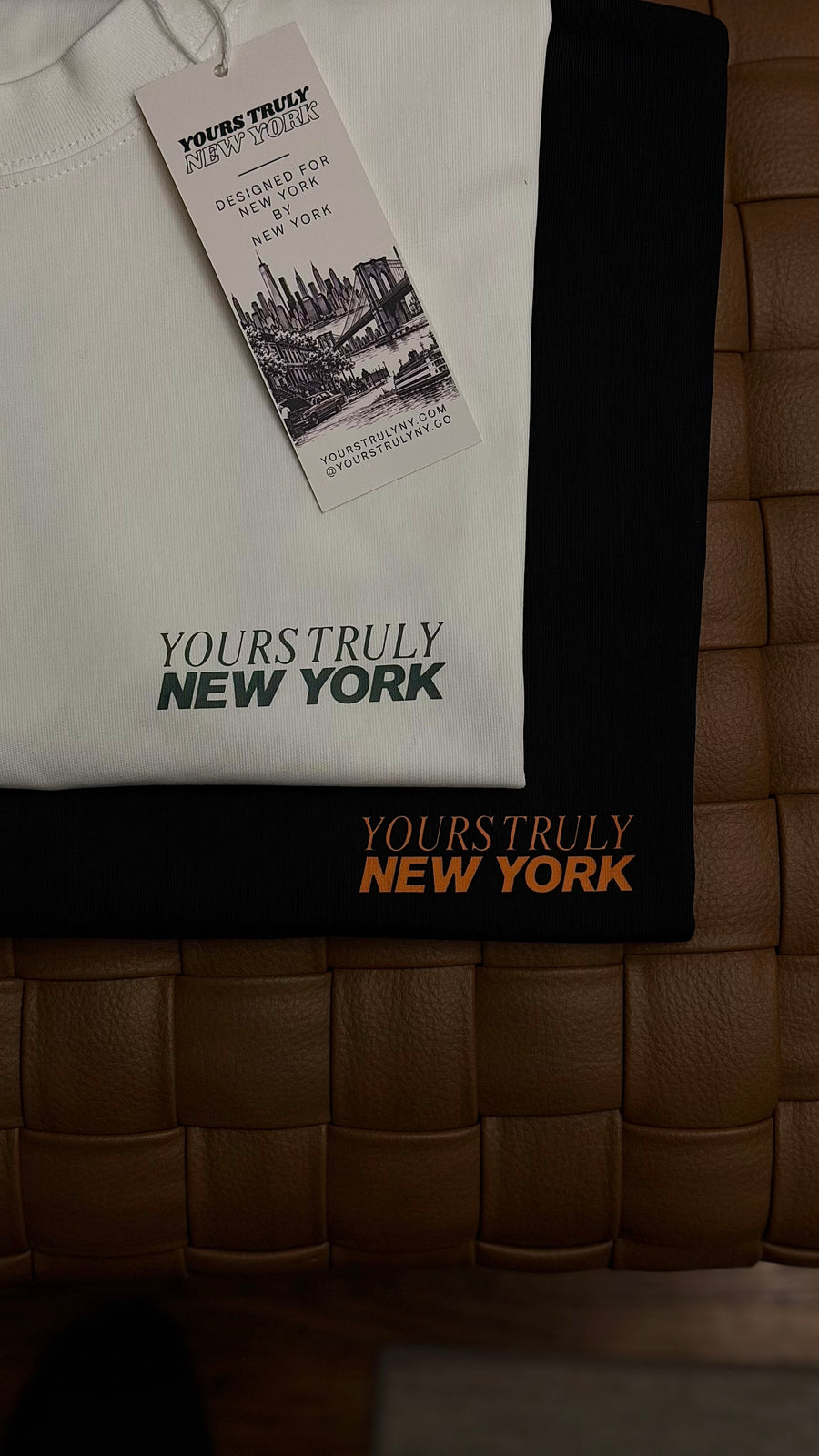 All Races Welcome oversized tees in white and black, front Yours Truly New York print with hang tag